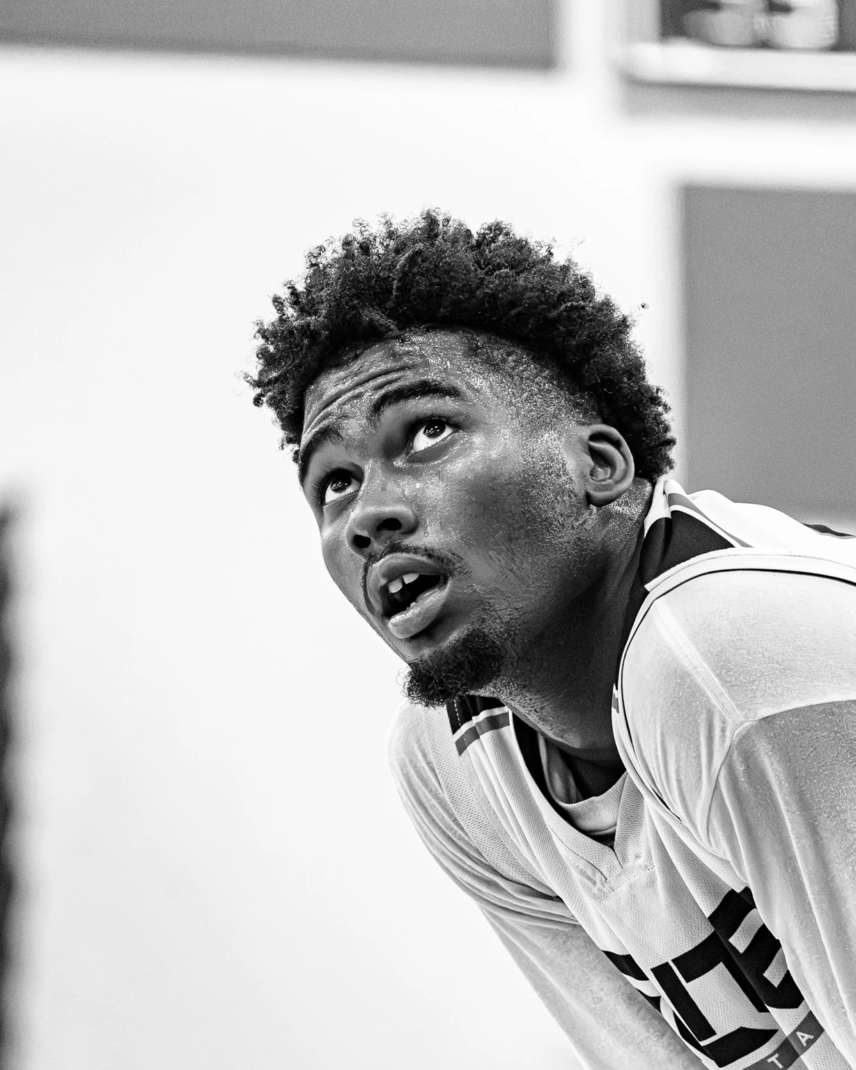 Basketball player driving toward the basket